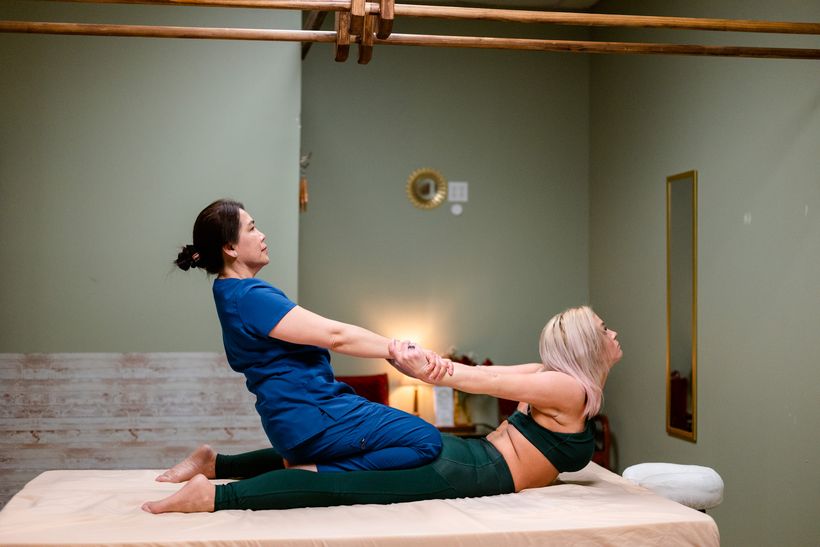 Traditional Thai massage stretch at Magnolia Wellness Massage